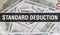 Standard Deduction text Concept Closeup. American Dollars Cash Money,3D rendering. Standard Deduction at Dollar Banknote.