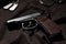 Standard handgun on dark fabric. Semi-automatic pistol