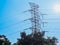 standard overhead power line transmission tower at sunset