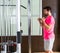 Standing biceps cable curl man in pulley machine