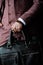 Standing Businessman in Suit with Leather Bag