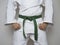 Standing fighter green belt centered martial arts