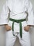 Standing fighter green belt martial arts white suit