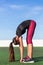 Standing forward stretch fitness woman stretching