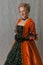 Standing girl in baroque dress