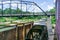 Standing on the historic War Eagle Bridge in Rogers, Arkansas one can see the working water wheel powered by the War Eagle River