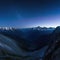 standing on mountaintop at night under clouds at sky