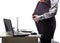 Standing pregnant woman in office