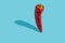 Standing red pepper on pastel blue background. Shadow on the left. Creative food concept