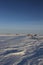 Standing stones found along an arctic landscape with snow on the ground