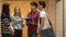 Standing students talking in locker room