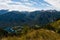 Standing on top of the mountain Planina Blato in the Triglav National Park in Slovenia looking down on Lake Bohinj and the village