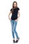Standing young woman with jeans and high heels