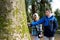 stanley park teen walking taking pictures fooling around looking at trees chatting spring cool weather tourists