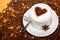 Star aniseed and cacao heart in coffee