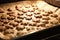 Star cookies on tray. Woman baked christmas biscuit