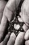 The star of david in the hands of a man