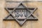 Star of David symbol on the exterior of an old prayer house in Kazimierz, the historic Jewish quarter of Krakow, Poland