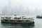 Star Ferry arrives to Kowloon pier in Hong Kong, China.