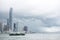 A Star Ferry vessel in service with hong Kong skyline.