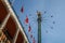 Star Flyer Ride Himmelskibet and Danish Flags at Tivoli Gardens Amusement Park - Copenhagen, Denmark