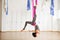 Star Inversion aerial antigravity yoga pose, woman exerciseses with hammock