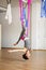 Star Inversion aerial antigravity yoga pose, woman exerciseses with hammock