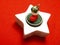 Star shape Christmas decoration on red tablecloth