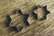 Star shaped pastry cutters on a wooden background - horizontal