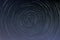 Star trails in a night sky  long exposure style realistic circular star arcs pattern