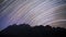 Star trails over Doi Luang Chiang Dao mountain at night