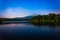 Star trails over Julian Price Lake at night, along the Blue Ridge Parkway in North Carolina.