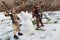 Star Wars LEGO action figures of Rey Skywalker and Chewbacca standing on half melted snow with statue of snow cat in the middle