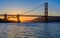 Starburst effect at sunset by the famous Golden Gate Bridge in