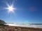 Starburst sun flares over Warriewood Beach