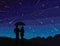 Starfall. Silhouette of couple under umbrella, watching falling stars.