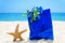 Starfish with gift bag on the beach - holiday concept