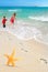 Starfish, kids and Footprints on Beach