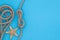 Starfish and rope on a blue bright background, summer nautical pattern