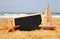 Starfish, sailboat and chalkboard, on sea sand and ocean horizon