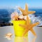 Starfish, Sea Shells In Yellow Bucket Ocean Waves