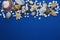 Starfish with Shells and stones Against a Blue Background with Copy Space. Summer Holliday. Nautical, Marrine concept.