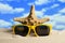 Starfish and sunglasses on the beach