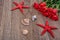 Starfishes, shells and red roses on a wooden background