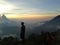 staring at the beauty of the tapestry of clouds above the top of Mount Gede Indonesia