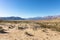 Stark dry southern California desert with blue sky, lonely empty and desolate, adventure hiking camping solitude, peaceful