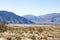 Stark dry southern California desert with blue sky, lonely empty and desolate, adventure hiking camping solitude, peaceful