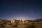 Starry night sky over a derelict house in the middle of the desert near Uspallata, Mendoza, Argentina