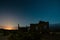 Starry night sky over a derelict house in the middle of the desert near Uspallata, Mendoza, Argentina