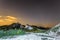 Starry night sky over the white chalky mountains. Natural landscape. Night view of the chalk hills.